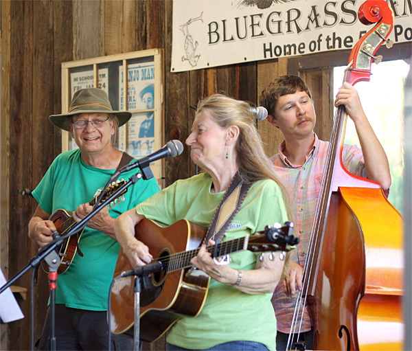 The Bluegrass Connection’s Robert Hicks on mandolin and Julie Moon on guitar, with Robert’s son Seth Hicks on bass, at Pine Mountain Bluegrass Jamboree.